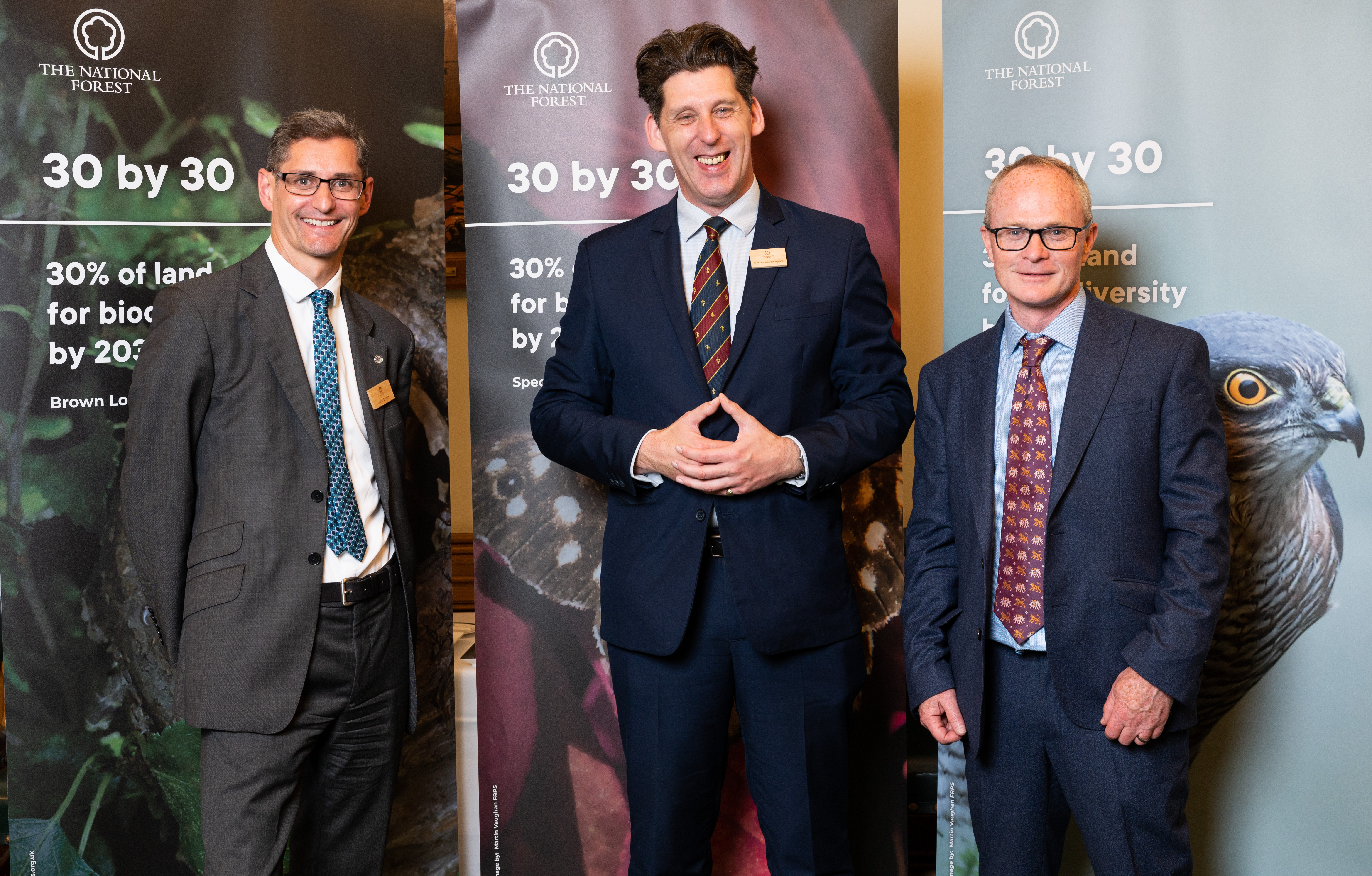 John Everitt (Chief Executive of the NFC), Dr Ian Duncan, (Chair of the NFC) and Dr Pete Brotherton (Director of Science of Natural England) stand in front of 30 by 30 banners